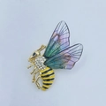 Elegant gold bee brooch featuring yellow stripes, rhinestones, and iridescent purple wings - Light KC Gold Purple Bee