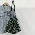 Canvas leopard print heart tote bag on blue denim jacket for casual street style look - Black Green Heart