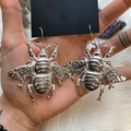 Silver-tone vintage oversized bee earrings with detailed insect wings held in hand - Large Bee Shape / Silver