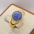 Vintage gold signet ring with round blue lapis lazuli stone shown at a 45-degree angle - Gold Blue Stone