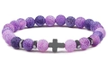 Detailed macro shot of purple dragon vein agate beads with a black metal cross charm - Purple Agate Style