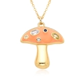 Macro shot of gold mushroom pendant with peach enamel and vibrant colorful gemstones - Orange