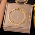Double-layered golden stainless steel bracelet with snake chain and bead detail - E2070 Blade Gold Bead Double Bracelet Gold
