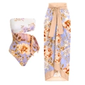 Detailed view of floral one-piece swimsuit with cutout and matching long sarong skirt - S / Lavender Floral Set