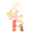 Resin letter R keychain with pink sequins, gold leaf and butterfly charm - Letter R