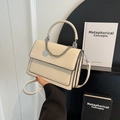 Elegant cream white flap handbag with metal chain and circular pendant detail - Off-white