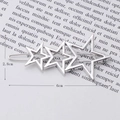 Detail view of silver alloy hair clip with three hollow stars and 6cm size label - Three Small Stars Silver