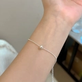 Close-up of a minimalist silver bead bracelet worn on a wrist with shimmering details - Silver Bead Chain Minimalist (MY36455)