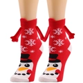 Detail of red Christmas socks with snowman pattern and magnetic hand-holding feature - Red Snowflake Snowman