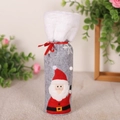 Christmas wine bottle cover in gray felt with white plush trim and festive red ribbon - Santa Claus
