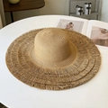 Macro shot of khaki woven straw hat with detailed tiered fringe edge and wide brim design - Large / Khaki
