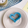 Matte blue heart-shaped hair claw clip placed on a decorative white ceramic plate - Approx 6.5cm / Lake Blue Heart