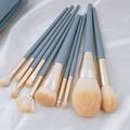 11-piece makeup brush set with grey-blue handles and golden tubes on white silk - 10Pcs Blue Bridge Bare Brushes (Large Edition)