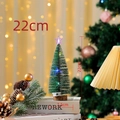 Detailed view of a 22cm lighted mini snowy cedar tree with a glowing star on wood base - 22cm Glowing Tree