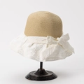 Close-up of beige woven straw crown with white jacquard fabric brim and a large side bow - M (56-58cm) / White