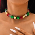 Star-shaped beaded necklace in red, green, and gold colors worn by a model - Star Style