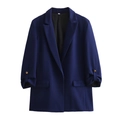 Detailed view of dark blue blazer featuring rolled sleeves and decorative gold cuff buttons - S / Dark Blue