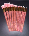 Macro view of 12-piece professional makeup brushes with glittering orange-pink rhinestones - 12pcs Set / Pink with Pink AB Rhinestones