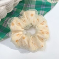 Detailed view of yellow polka dot organza scrunchie with white floral print on white background - Yellow Sunflower Lace Double Layer