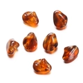 Close-up of translucent amber acrylic irregular beads with natural fluid textures - Irregular 01 / 10 Pieces Pack / Brown