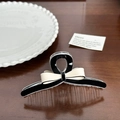 Elegant black and white acetate bow hair claw clips on a minimalist wooden background - Black Base Bowknot Medium-11cm