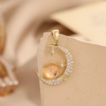 Golden crescent moon and orange planet pendant with stars on light stone base - Gold Moonstone Star Moon Planet