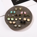 Vintage cat-eye resin and pearl earring set in various shapes on a gray display tray - Multicolor Style (E0243-3)