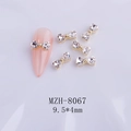 Macro view of MZH-8067 bow heart rhinestones for nail art measuring 9.5x4mm - Clear Gold Base Bow (8067)