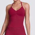 Close-up of seamless dark red ribbed yoga tank top with V-neck and halter design - Burgundy