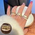 Golden stackable ring set with white enamel and sparkling crystals on female hand - JZ9996 Gold Enamel Wave Ring Set