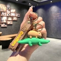 Cute Capybara riding a green crocodile keychain with a brown silicone hand strap - B207-4 Riding Crocodile