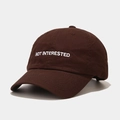 Detailed view of white letter embroidery and stitching on the brown baseball cap - M(56-58cm) / Brown