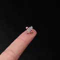 Rose gold fan shaped cartilage earring with clear zircon stones held between fingers - Fan Radiant Style (319-6#R)