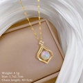 Detail of gold teardrop pendant with opal stone and diamond accents in a jewelry box - Mermaid Teardrop Style (D202)