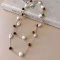 Double-layered gold necklace featuring baroque pearls and tiger eye stones on vintage book - Baroque Pearl Long Necklace / 35# Gold-Coffee-White