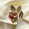 Vintage golden bee and leaf brooch with red and amber rhinestones on cream satin - Style 30