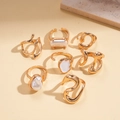 Detailed top view of a seven-piece gold ring set with irregular pearls and enamel accents - Gold (7-Piece Set)