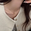 Elegant gold necklace with minimalist round bead pendant worn on beige knitwear - Gold Round Bead Style (XL2805)