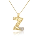 Macro shot of gold letter Z pendant with silver detail and zircon on box chain - Letter Z