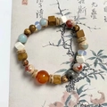 Handmade beaded bracelet featuring natural blue, brown, and translucent orange stones - Natural Shoushan Stone Bracelet