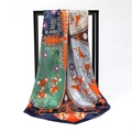 Silky satin square scarf with bohemian floral and geometric print on a display stand - Joyful Heart Orange (SD90-19-3)