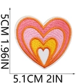 Detailed view of heart-shaped embroidery patch with dimensions 5.1cm by 5cm for apparel - Style 18 (Pink White Heart)