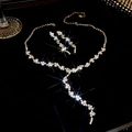 Silver geometric necklace and earring set with shimmering tassels on black velvet - Tassel Style Pave Diamond Set / Silver