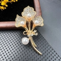 Close-up of golden brooch with elegant pearls and sparkling crystals on black velvet - BZ018 Elegant Bouquet