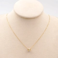Collana minimalista in acciaio al titanio dorato con ciondolo a cilindro e zirconi - Oro