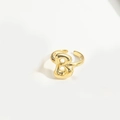 Detailed macro view of a polished gold letter B open ring with balloon style design - Gold Letter B