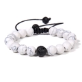 Detailed macro view of white marble beads and black lava stone on adjustable cord - White Howlite (Woven)