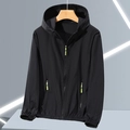 Detail view of men's black sun-protective jacket with neon green zipper and elastic cuffs - M / Black