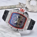 Detail view of the diamond-set tonneau bezel and skeletonized dial on this sport watch - Black Dial Silver Case Black Strap