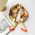 Elegant orange floral silk square scarf tied gracefully on a minimalist white table - Orange Border White Peony